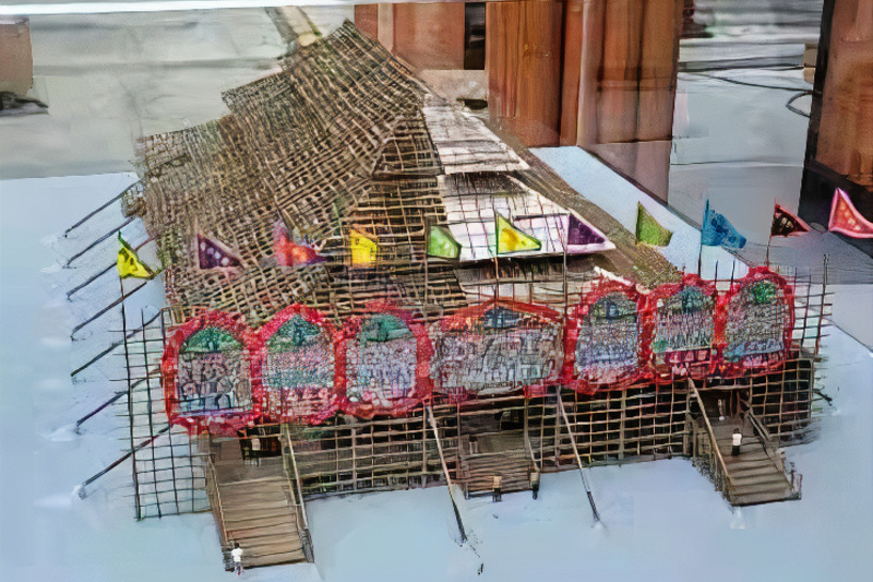 Pyramid-like roof of the model of "dragon boat ridge" bamboo theatre